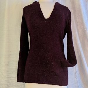 Maroon v-neck hooded sweater.